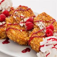 Crunchy French Toast · Three extra thick slices of bread rolled in crunchy froasted flakes, spinkled with almonds, ...