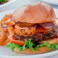 Wild West Burger · Ground beef patty, applewood bacon, onion rings, bbq sauce, cheddar cheese, lettuce, tomato ...