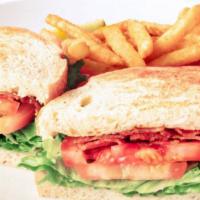 Club Sandwich · Triple decker sandwich filled with oven roasted turkey breast, bacon strips, lettuce, tomato...