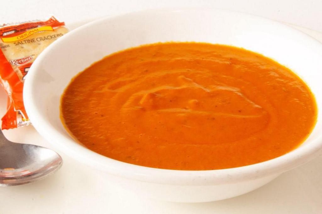 Tomato Basil Soup · A cup of our tasty tomato basil soup.