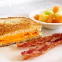 Kids Grilled Cheese · 1/2 Grilled cheese sandwich with choice of 2 sides and a drink.