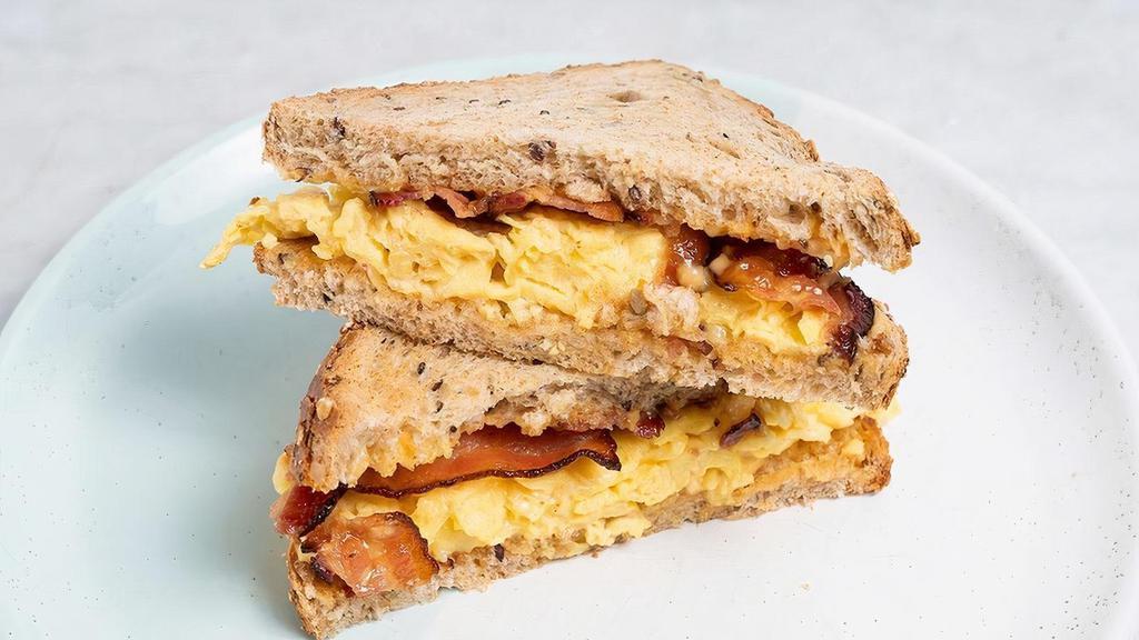 Bacon, Egg & Cheese Sandwich · Multigrain Toast with scrambled egg, bacon, cheddar & chipotle mayo.