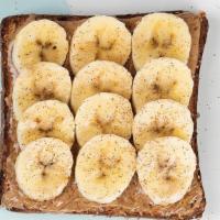 Banana Toast (N) · Almond butter, fresh sliced banana, cinnamon & honey on Multigrain Toast.