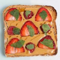 Peanut Butter & Berry Toast (N) · Peanut butter, strawberries, raspberries, honey & mint on multigrain toast. A fresh take on ...