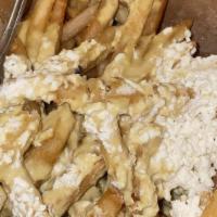 King Fries · skinny fries topped off with hummus & feta cheese

OPTIONAL: Top off King Fries with choice ...
