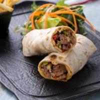 Grilled Steak Burrito · Grilled steak filled with rice, beans, mild salsa, melted mixed cheese, sour cream and pico ...