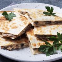 Grilled Steak Quesadilla · Delicious grilled steak with pico de gallo, melted mixed cheese and served with salsa and so...