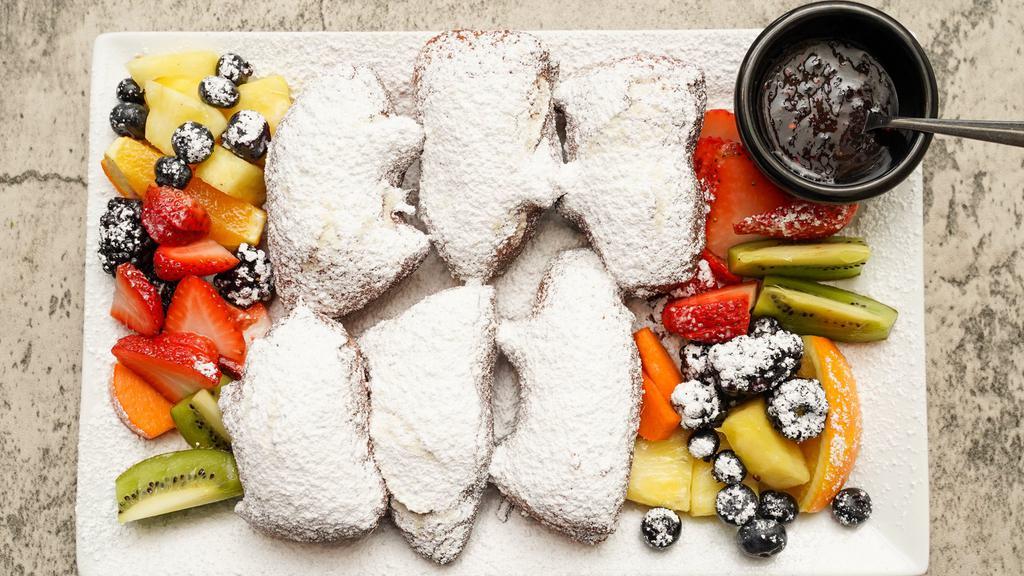 Beignets · deep fried & topped w/ lots of powdered sugar, fresh seasonal fruit, house made jam.