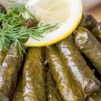 Stuffed Grape Leaves · The Grape Leaves are filled with rice, Sauteed onion, tomato, fresh herbs(cilantro, basil, m...