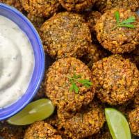 Falafel-Appetizer · Deep-fried ball or patty-shaped fritter made from ground chickpeas, fava beans, Parsley, Ser...