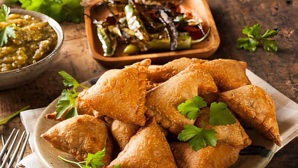 Samosa · Fried or baked dish with a savoury filling, such as chicken, spiced potatoes, onions, peas, or lentils.
You can order with or without chicken.