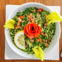 Tabouleh Salad · Tabbouleh is a Levantine salad made mostly of finely chopped parsley, with tomatoes, mint, o...