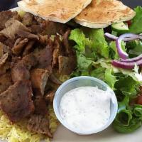 Gyro Plate · Beef and Lamb served with rice, salad, pita bread, hummus, and Garlic sauce.