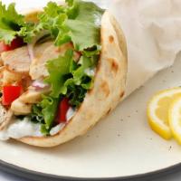 Chicken Gyro Wrap · Grilled Chicken wrapped in a pita bread with lettuce, tomato, onion, hummus, jalapeños comes...