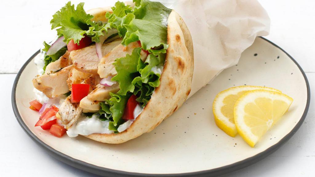 Chicken Gyro Wrap · Grilled Chicken wrapped in a pita bread with lettuce, tomato, onion, hummus, jalapeños comes with garlic sauce & house sauce.