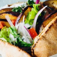 Eggplant Veggie Gyro Wrap · Eggplant wrapped in a pita bread with lettuce, tomato, hummus, jalapeños comes with garlic s...