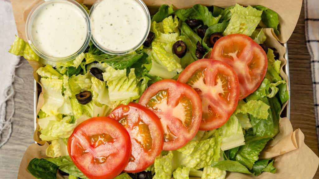 Green Salad · Lettuce, tomatoes, olives, and shredded carrots. With sides of ranch.