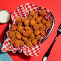 Popcorn Chicken · Bite-sized seasoned chicken with your choice of dipping sauce.