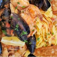 Seafood Cioppino · Traditional Italian stew with mussels, shrimp, clams, fish, calamari and scallops in a garli...