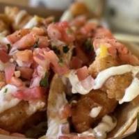 The Classic Fish Taco · Beer battered Ensenada-style, with citrus slaw, fresh pico de gallo and our signature crema ...