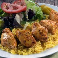 Chicken Breast Kabob Plate · Chicken breast grilled on a skewer, served with mixed green salad, rice pilaf, pita bread.