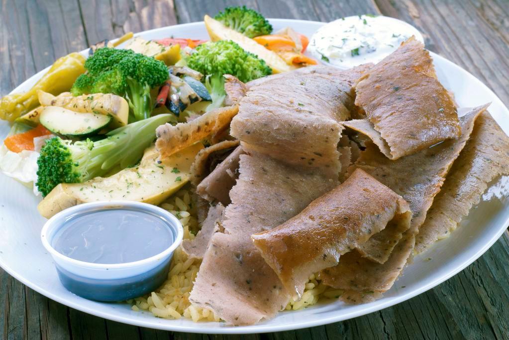 Gyros Plate With Grilled Veggies · Beef/Lamb shaved off a vertical broiler, served with rice pilaf, grilled vegetables, tzatziki sauce, pita bread.
