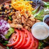 Smoky Barbecue Ranch · Fresh spring mix with cheddar cheese, red onion, sliced tomato, bacon and croutons served wi...