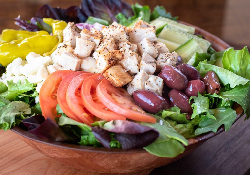 Mediterranean Salad · Fresh spring mix with sliced tomato, kalamata olives tangy crumbled feta cheese, red onion, cool cucumbers and pepperoncini peppers. Dressing suggestion: herb vinaigrette. (Includes 2 2oz. cups)