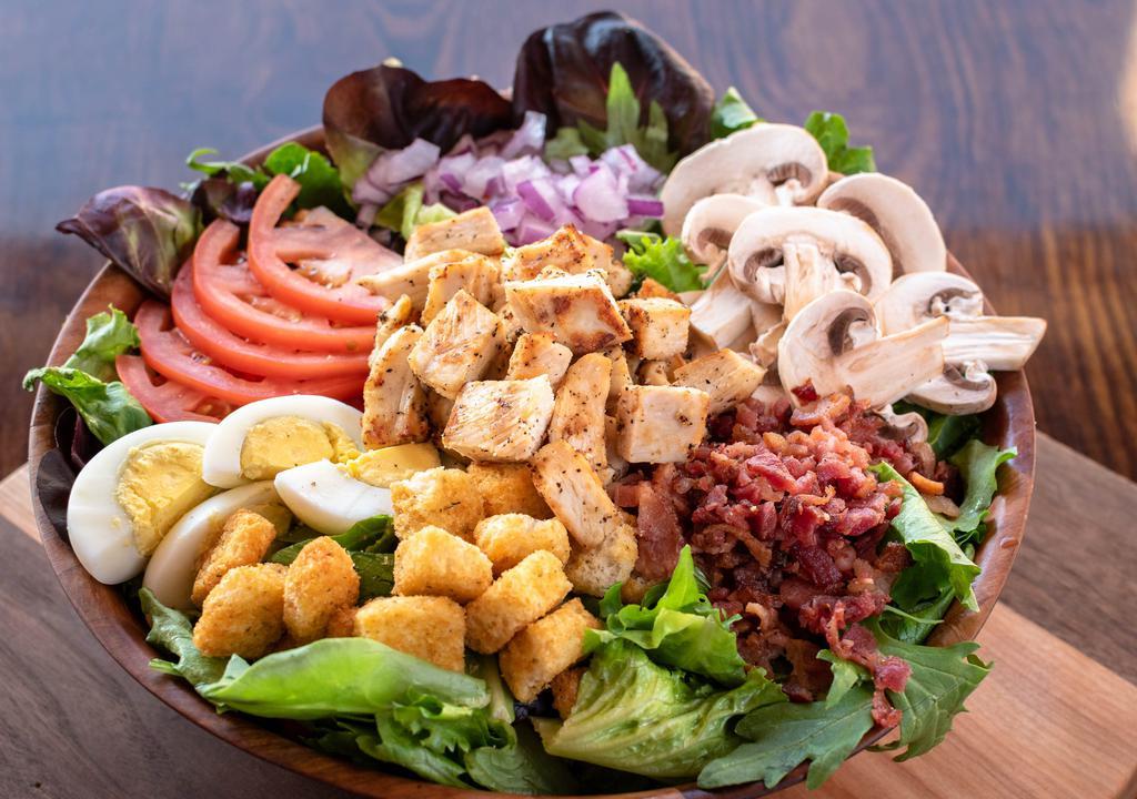 (Not) Spinach · Fresh spring mix with sliced tomatoes, red onion, fresh sliced mushrooms, sliced hard-cooked egg, bacon and herb croutons. Dressing suggestion: herb vinaigrette. (Includes 2 2oz. cups)