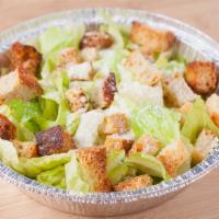 Caesar · Romaine lettuce, parmesan cheese, caesar dressing and homemade garlic seasoned croutons.