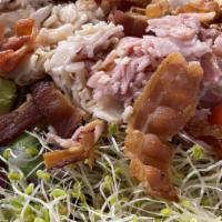 Chef Salad · Fresh lettuce, sprouts, tomato, onion, egg, bacon, ham, turkey, swiss & cheddar.