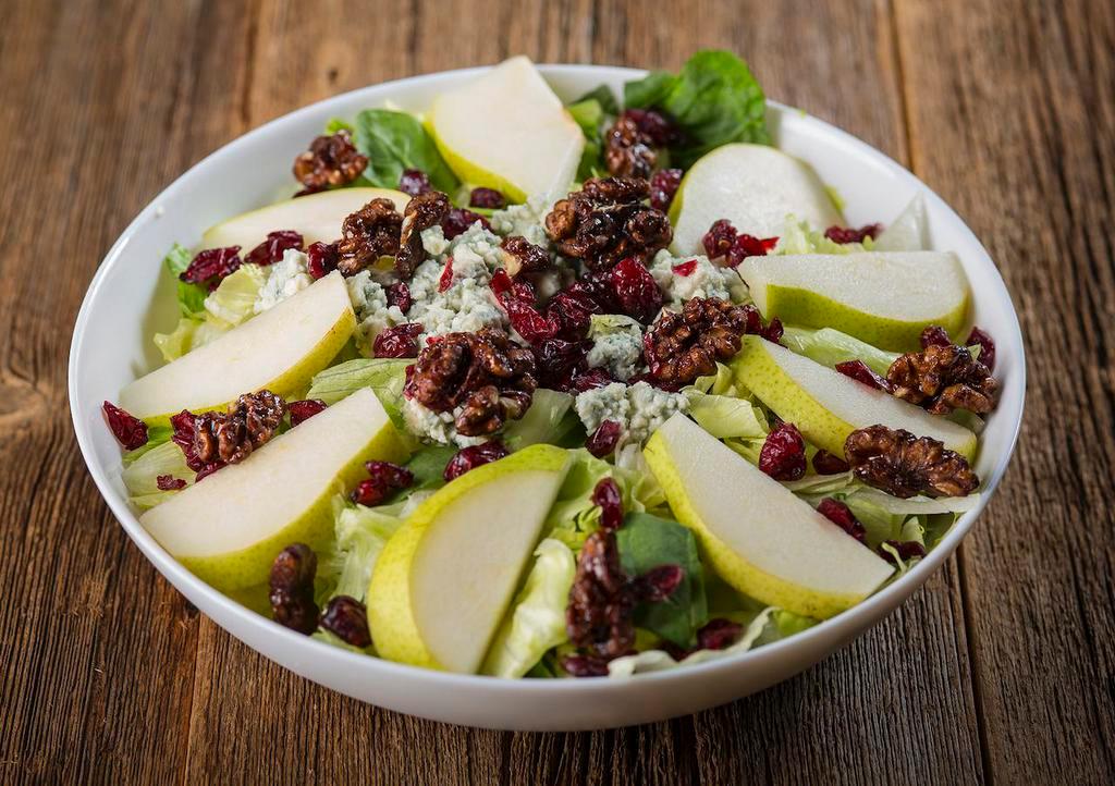 Harvest Salad · Romaine and iceberg lettuce, spinach leaves, sliced fresh pear, craisins, candied walnuts & bleu cheese crumbles. 530 calories.
