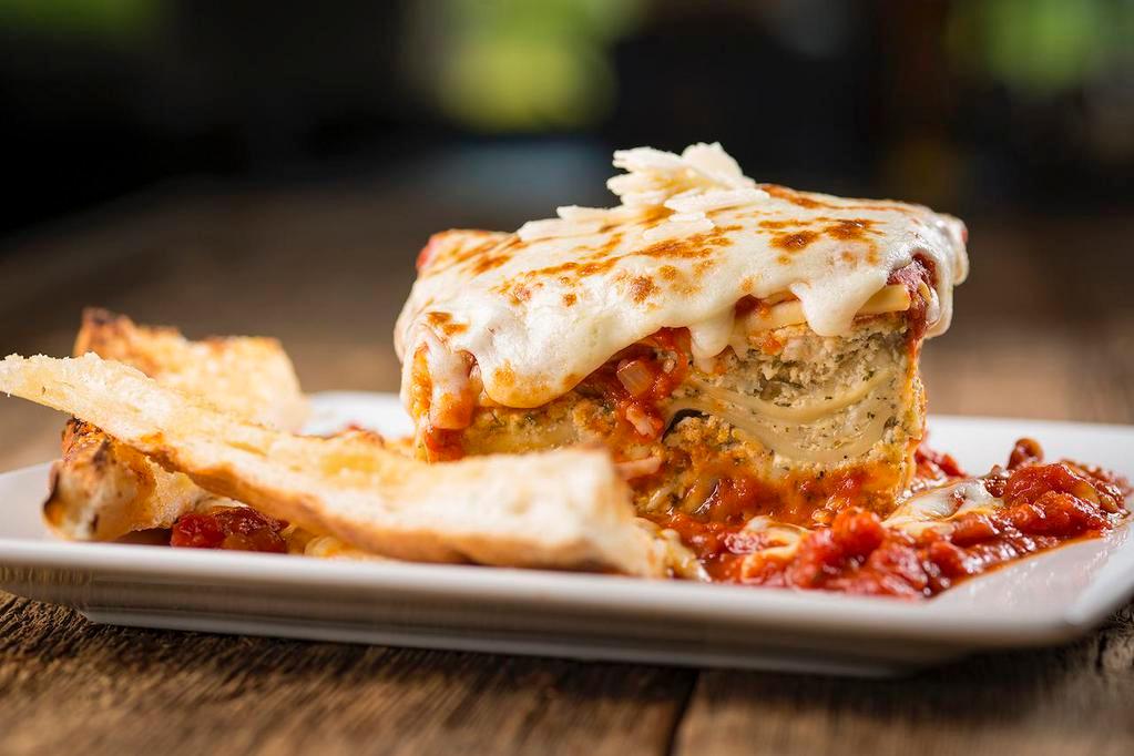 Lasagna · Home-made from the family recipe: layers of ribbon noodles & three cheeses, smothered in marinara sauce, topped with baked mozzarella cheese & fresh parsley.
