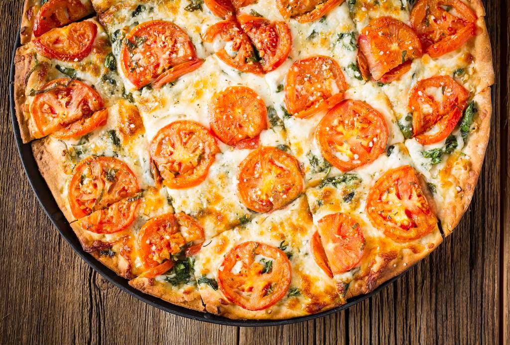 White · Vegetarian Deep Dish or  Stuffed Pizza with Olive Oil (no Pizza Sauce), Wisconsin Mozzarella Cheese, Fresh Garlic, Tomato and Seasoned Ricotta.