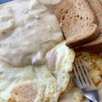 Country Fried Steak With Gravy & Eggs Breakfast · Country Fried Steak with Gravy, three eggs, hash browns, toast.