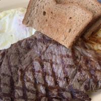 Steak & Eggs Breakfast · Ribeye steak, three eggs, hash browns, toast.