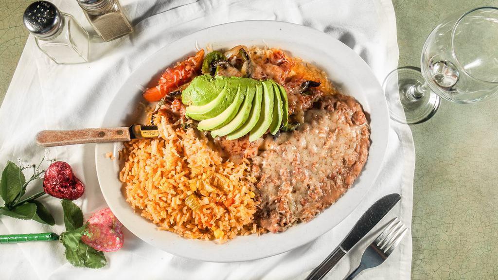 Pollo Caliente · Served with spinach rice and refried beans or black beans. your choice of tortillas corn or flour.