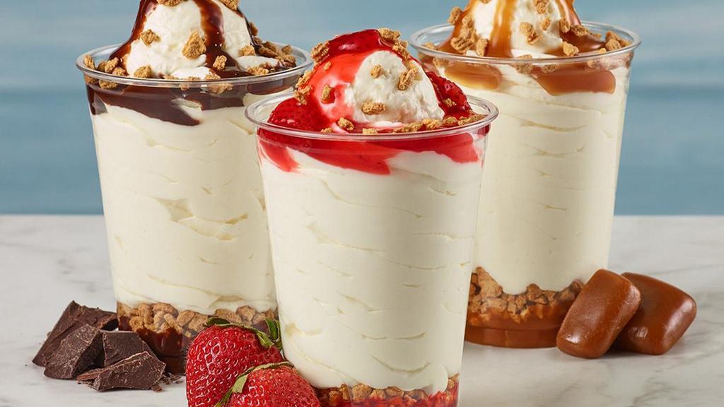 Cheesecake Sundae · Layers of rich flavor make our Cheesecake Sundaes a treat you can keep digging in to. Our Strawberry Cheesecake Sundae made with real strawberries, our Fudge Cheesecake Sundae made with velvety chocolate fudge, or our Caramel Cheesecake Sundae made with rich caramel.