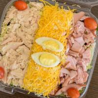 Chef Salad · Ham, turkey, Cheddar cheese, and hard boiled egg with ranch dressing on the side.
