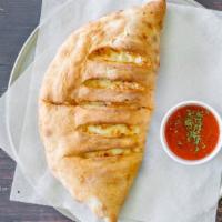 Calzone W/ 1 Topping Lunch · Calzone stuffed with ricotta and/or mozzarella cheese plus add toppings