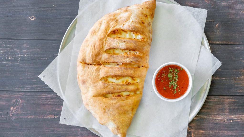 Cheese Calzone · Stuffed with ricotta and/or mozzarella cheese served with marinara sauce inside or on the side.