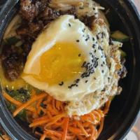 Bibimbap W/ Bulgogi · Korean rice bowl served with our Beef Bulgogi, Shiitake Mushrooms, Spinach, Carrot, Squash, ...