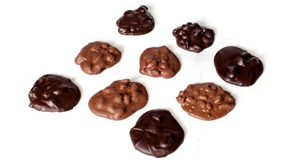 Clusters · Roasted almonds, roasted cashews, coconut, macadamia nuts, pecans and other ingredients covered in rich milk chocolate, semi-sweet dark chocolate or white confection.