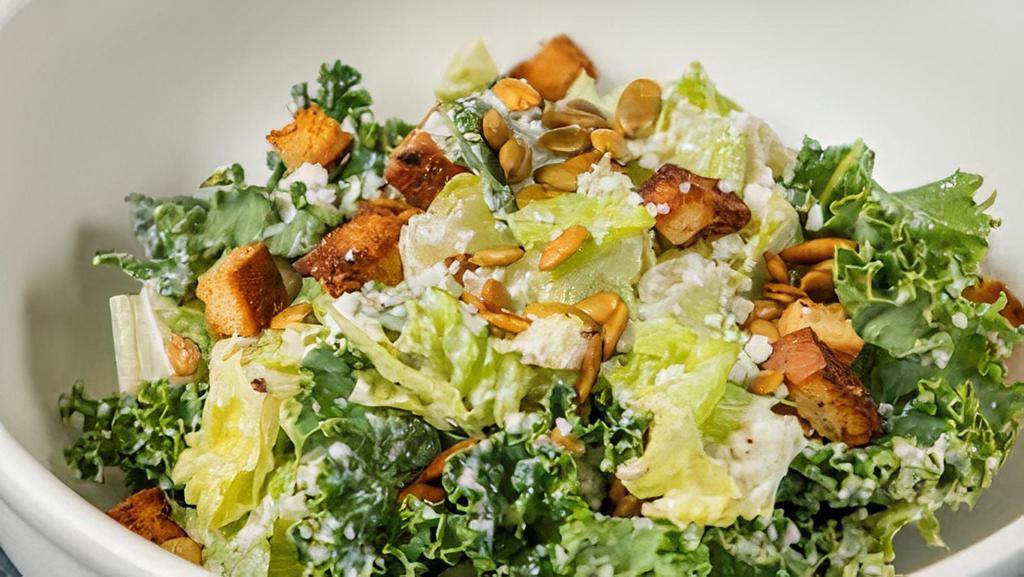 Caesar Salad · Organic. Organic romaine, kale toasted pepitas, cotija cheese, caesar dressing, herb croutons.