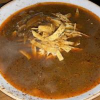 Tortilla Soup · Pasilla tomato broth, sautéed onions, shredded chicken, avocado, tortilla strips, jack chees...