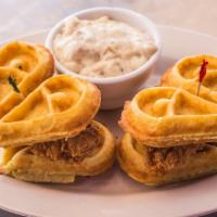 Chicken And Waffle Sliders · Two crispy fried chicken breast and waffle sliders served with country sausage gravy, syrup ...