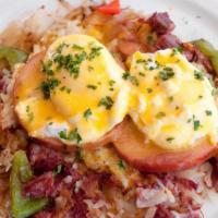 Corned Beef Hash Benedict · Griddled corned beef brisket, onions, bell peppers and potato hash, with Canadian bacon and ...