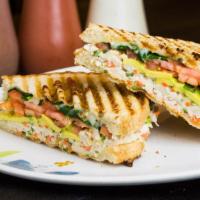 Grilled Paninis · Choice of tuna, chicken, or sliced turkey breast with tomatoes, spinach and mozzarella on gr...