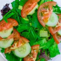 Garden Salad · Mixed greens, tomato, cucumber, and your favorite dressing.