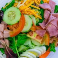 Chef Salad · Mixed greens, shredded cheddar, and jack cheese, ham, turkey, hardboiled egg, cucumber, toma...